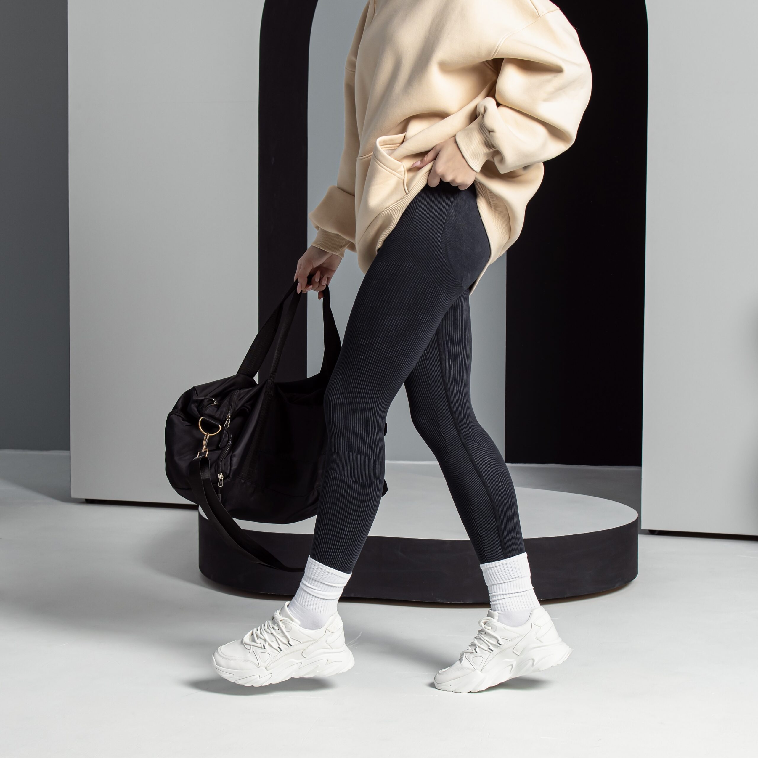 Woman,In,Black,Leggings,And,White,Sneakers.,Vertical
